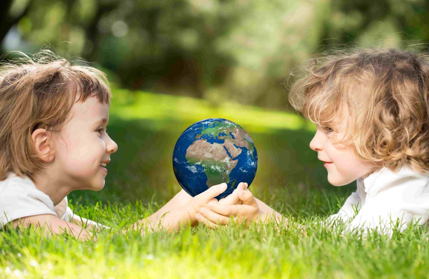 childrens-holding-world-hands-against-green-spring-background-earth-day-concept-elements-this-image-furnished-by-nasa-scaled.jpg